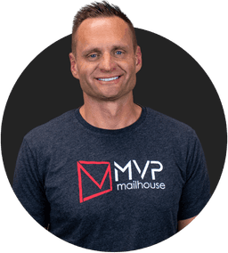 Headshot of Aaron from MVP Mailhouse wearing a branded T-shirt with a smile