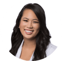 Portrait of a smiling Asian female dentist in professional attire