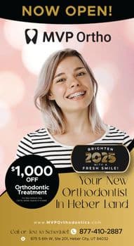 This vibrant promotional postcard announces the opening of MVP Ortho, an orthodontic branch of MVP Dental, located in Heber City, UT. The postcard features a large, cheerful photo of a young woman with blonde hair and braces, smiling broadly against a soft pink background. The top of the postcard reads NOW OPEN! in bold yellow letters, and the logo for MVP Ortho is prominently displayed. Below the main image, there are two large, overlapping black circles with gold trim. One circle offers $1,000 OFF Orthodontic Treatment for new patients, and the other circle encourages patients to Brighten 2025 with a Fresh Smile! The postcard provides contact information at the bottom, including a phone number and website, and invites patients to call or text to schedule an appointment. The overall design is modern and inviting, emphasizing accessibility and the promise of a new, confident smile.