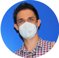 Portrait of a male orthodontist wearing a protective mask